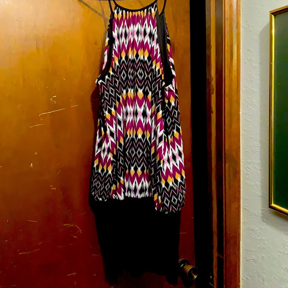It is a black strapped mini dress